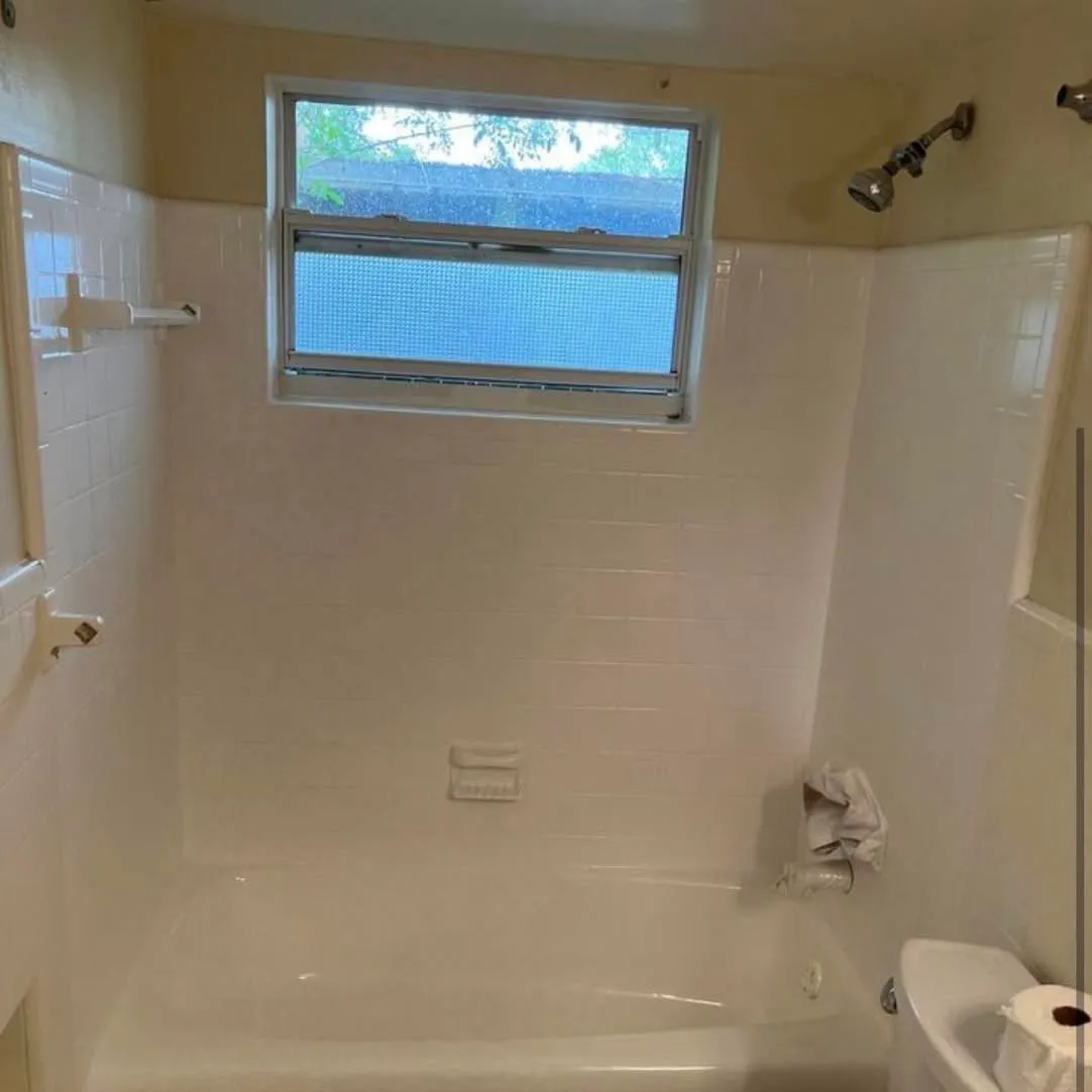A refinished tub and tile surround after resurfacing